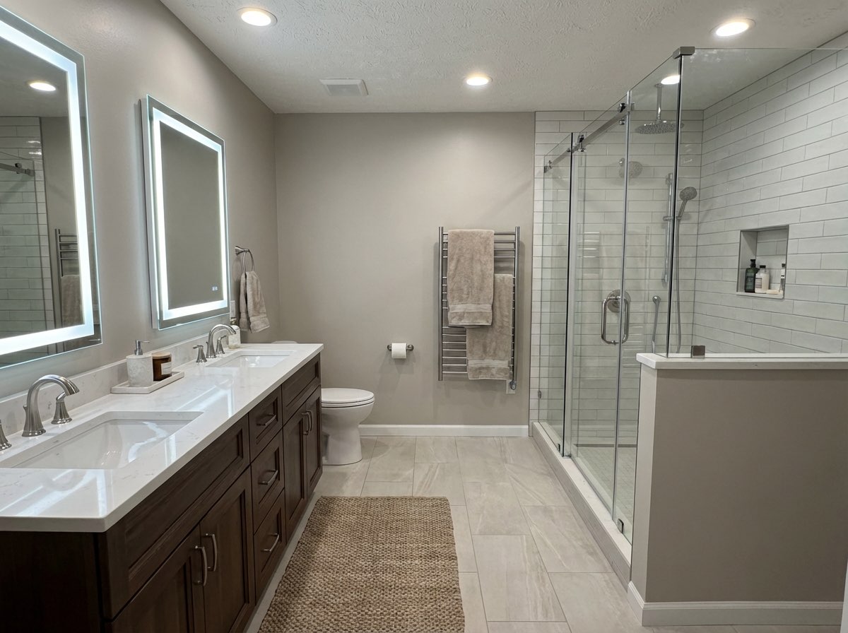 Bathroom transformation featuring modern lighting and clean lines