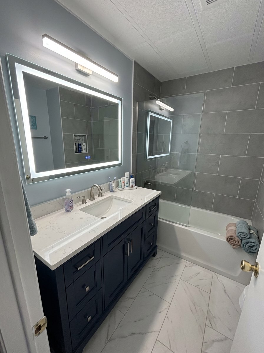 Bright bathroom makeover with white subway tile and chrome fixtures