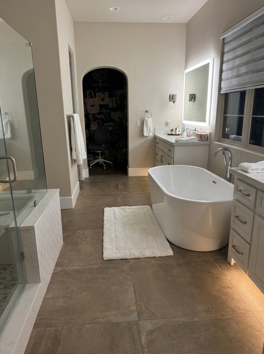 Bathroom remodel idea featuring herringbone floor and updated hardware