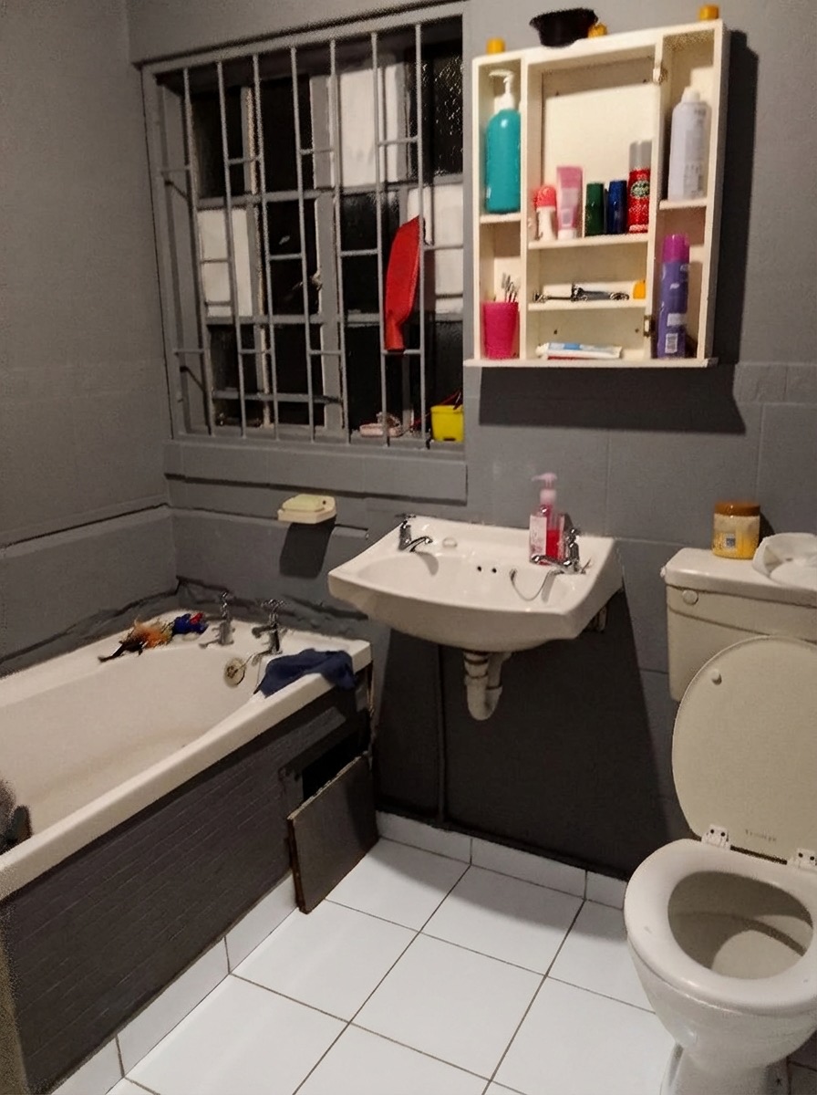 Concrete-look bathroom floor renovation for an industrial aesthetic