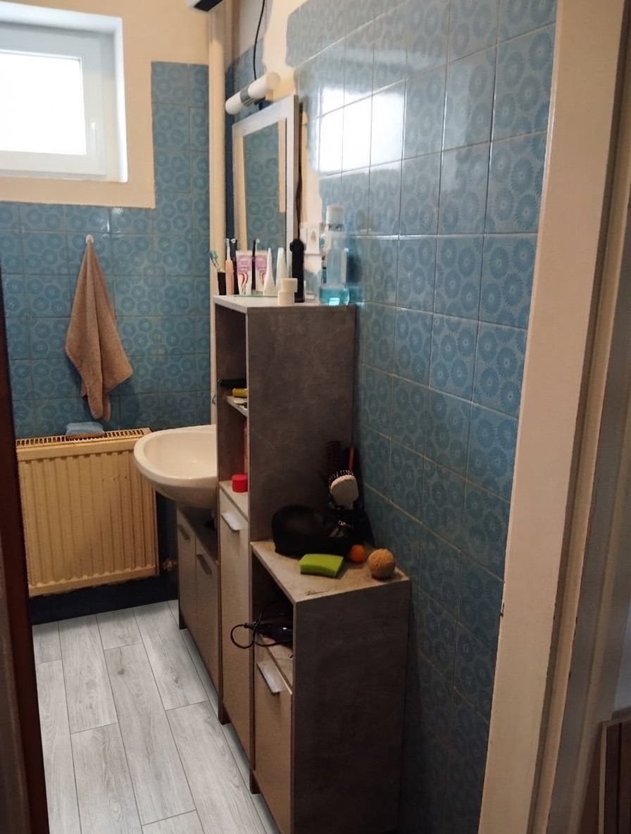 Encaustic cement tile bathroom floor makeover with bold geometric pattern