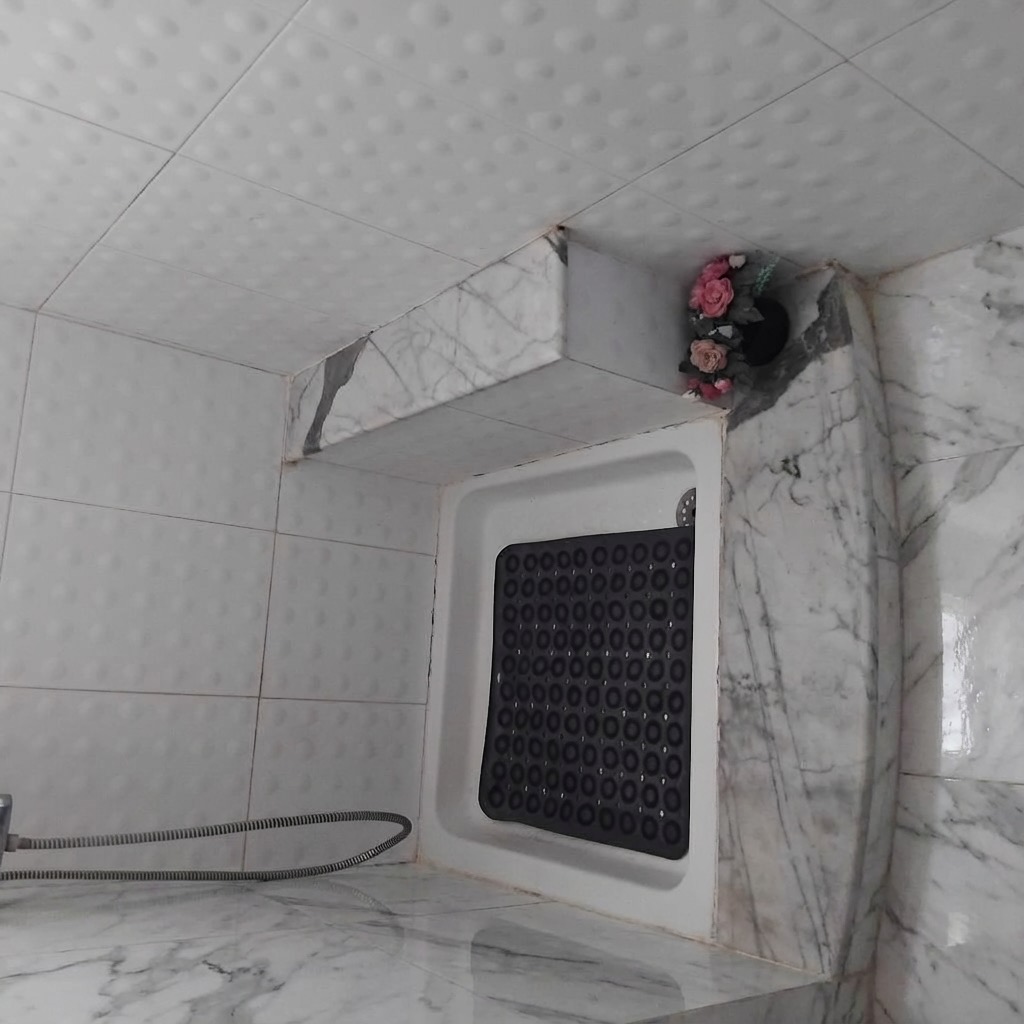 Hexagonal tile bathroom floor transformation - before and after