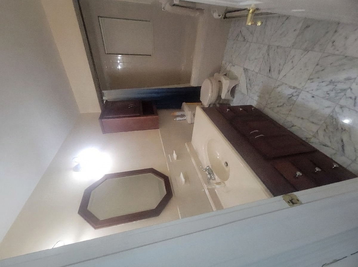 Bathroom floor upgrade with large-format porcelain tiles - AI generated