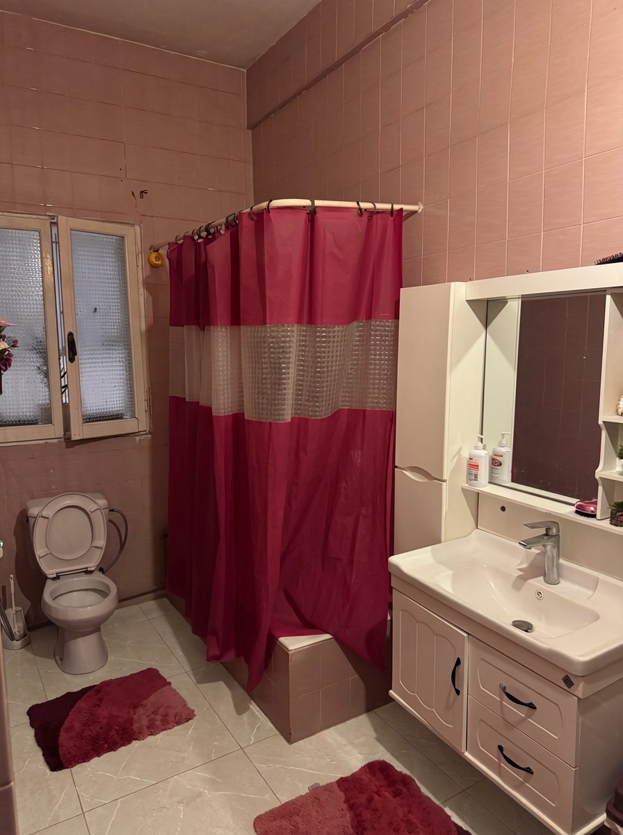 Heated bathroom floor installation with natural stone tile - AI generated