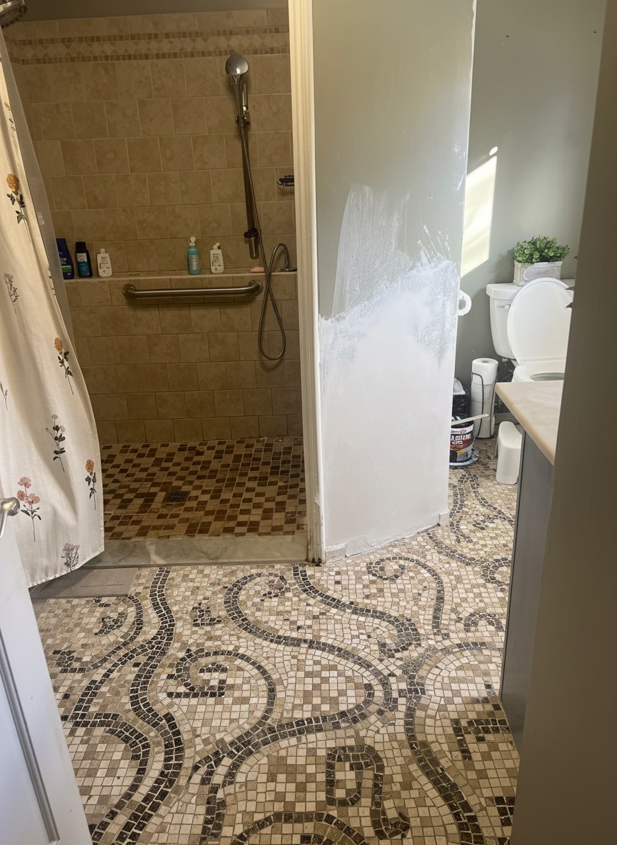 Bathroom floor renovation with herringbone tile pattern