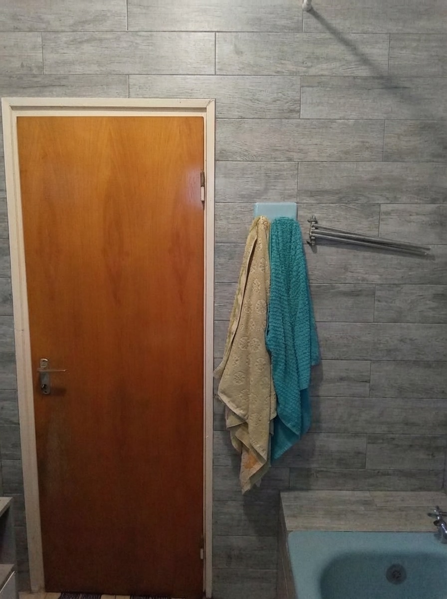 Bathroom wall change to vertical stacked tile in matte finish - AI
