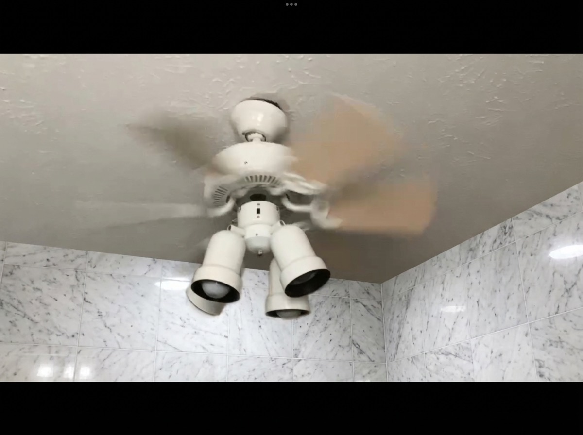 Wainscoting bathroom wall update with painted upper and tiled lower half