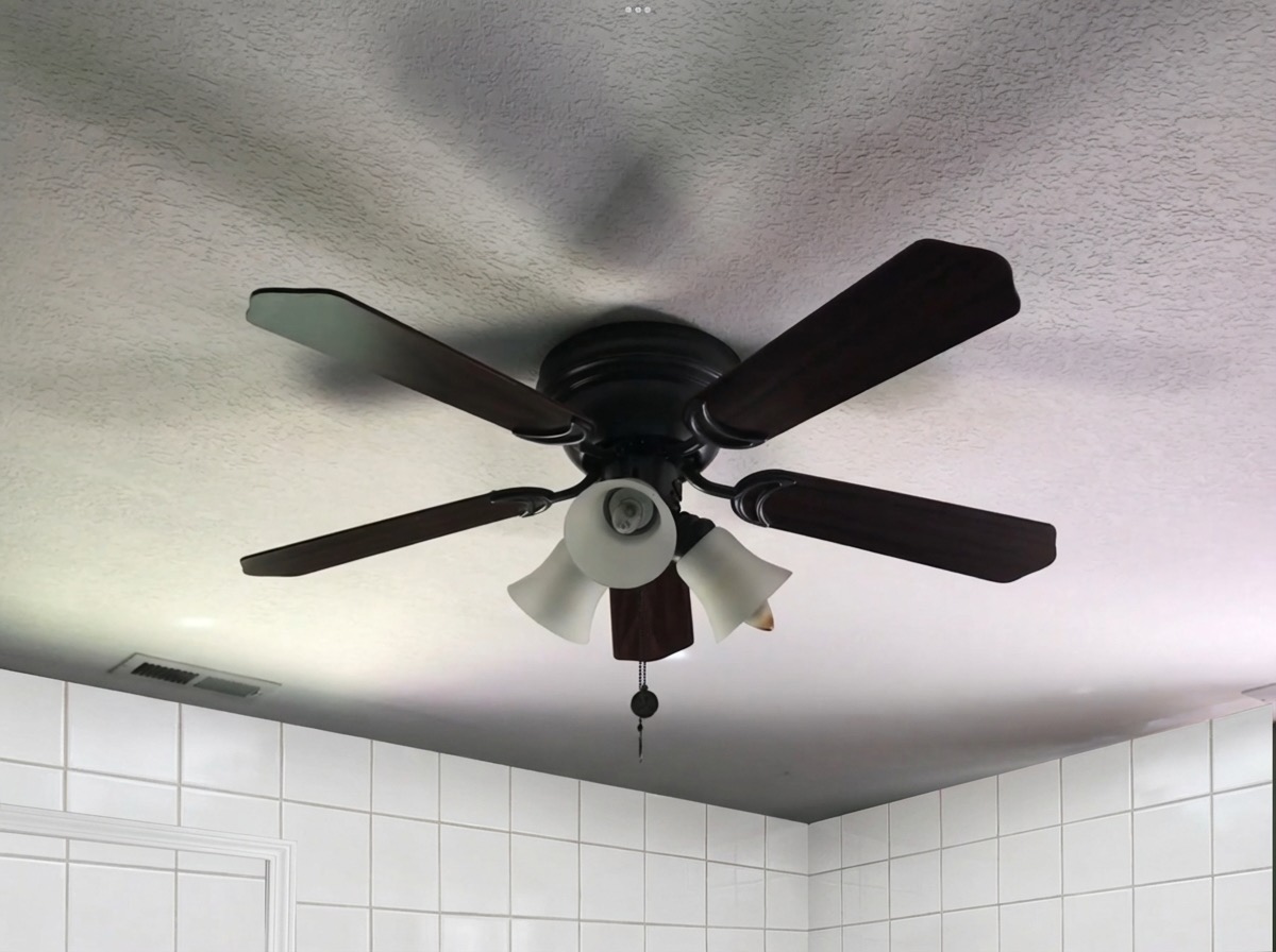 Board and batten bathroom wall transformation in sage green - AI tool