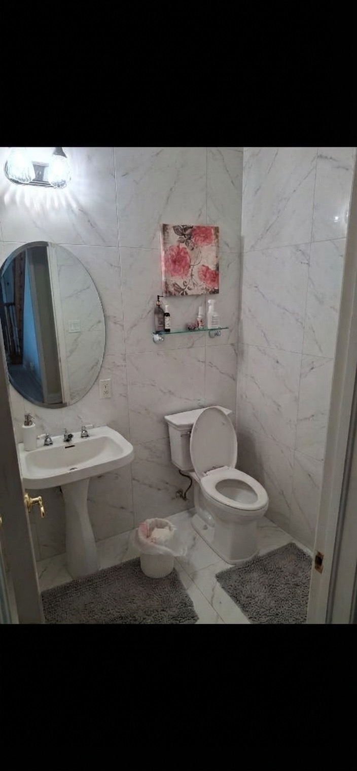 Accent wall bathroom redesign with mosaic tile