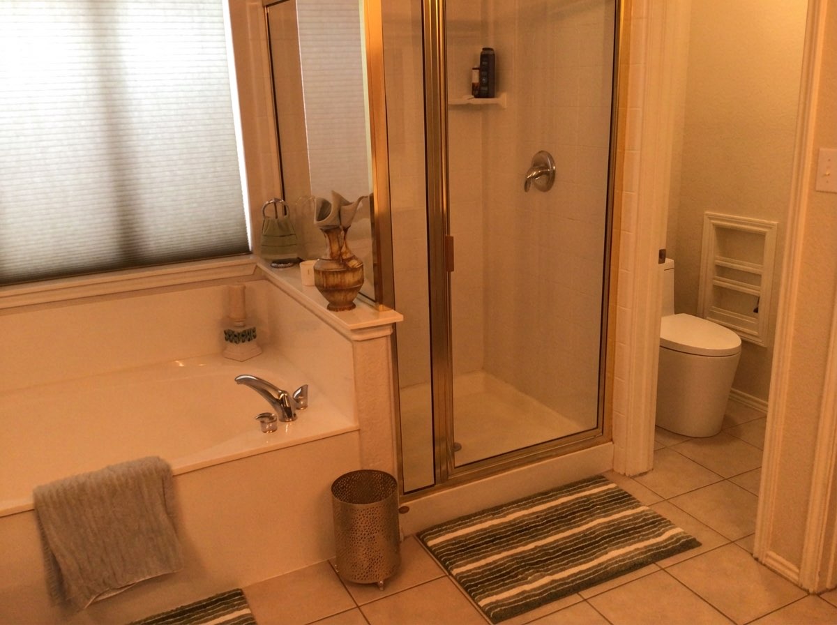 Bathroom hardware upgrade with brushed gold faucet and towel bar