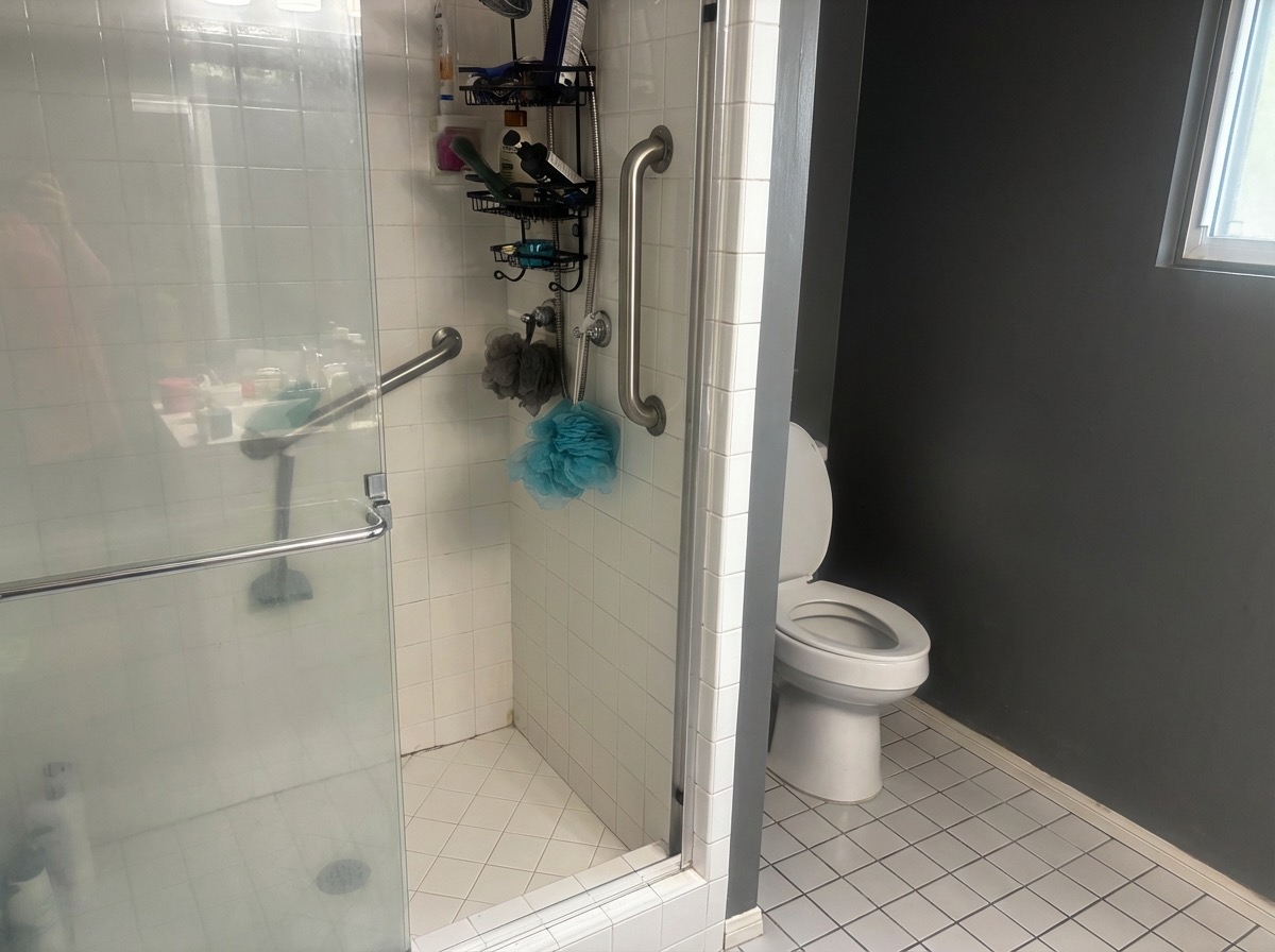 Cluttered countertop cleared for a minimalist bathroom surface - AI tool