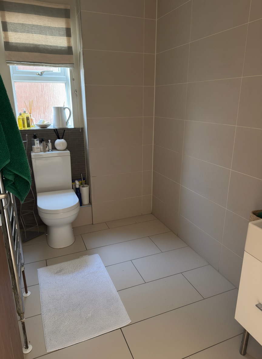 Unnecessary bathroom niche removed for a smooth modern wall