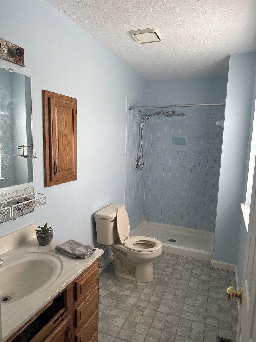 Old towel rack removed for a streamlined heated towel rail - AI design