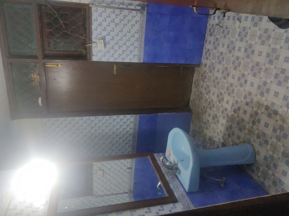 Unnecessary bathroom niche removed for a smooth modern wall