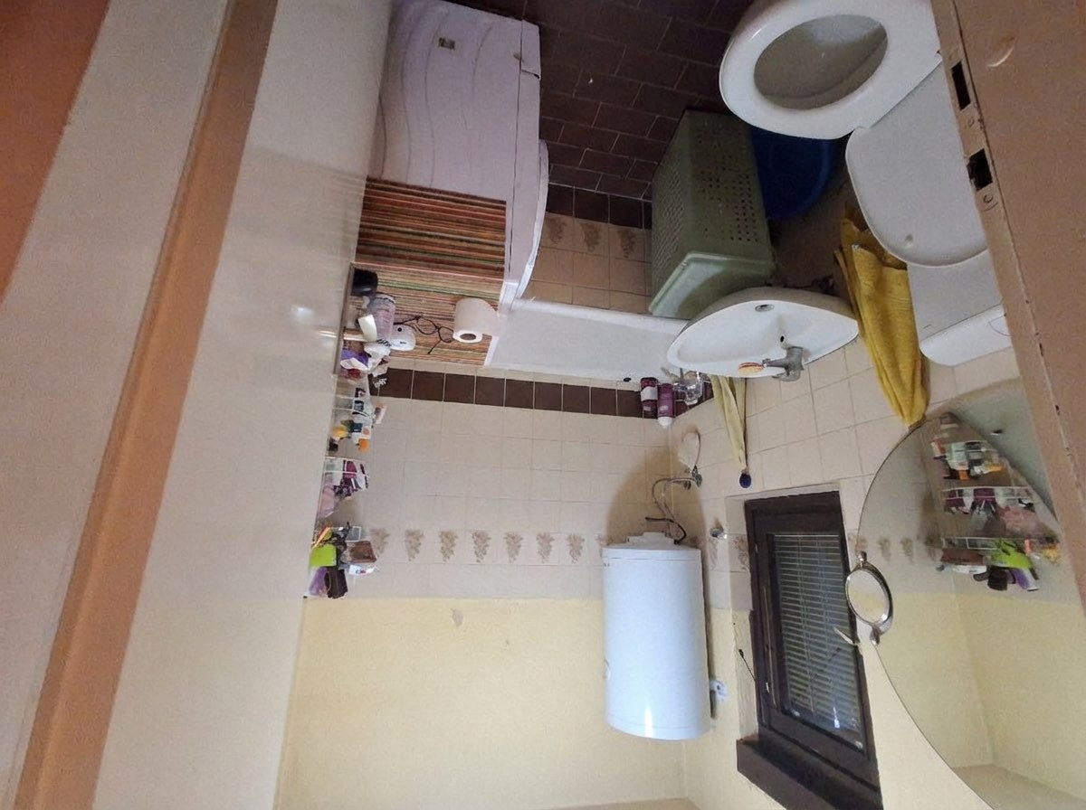 Transitional bathroom redesign blending classic and modern style references