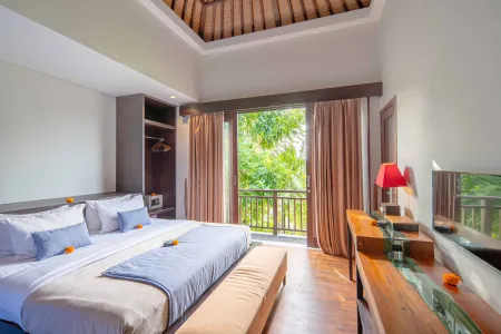 Luxurious Balinese villa bedroom with king bed, open doors to lush tropical balcony view, wooden furnishings and orange floral accents.