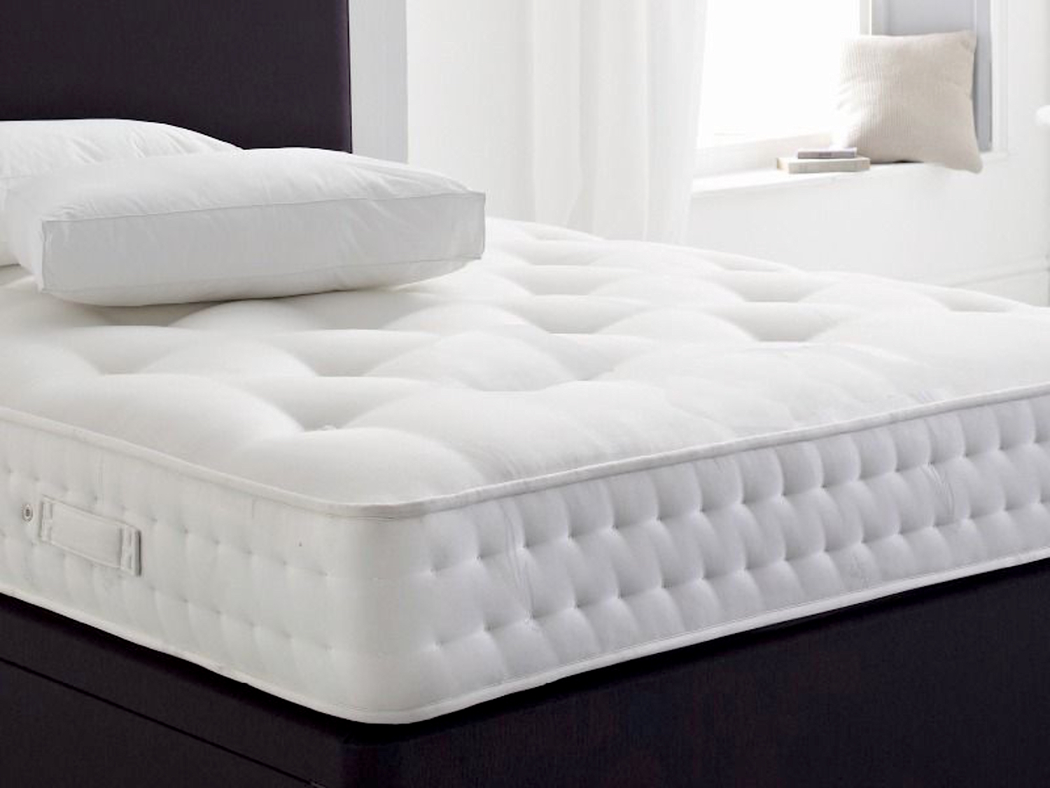 white bed with mattress