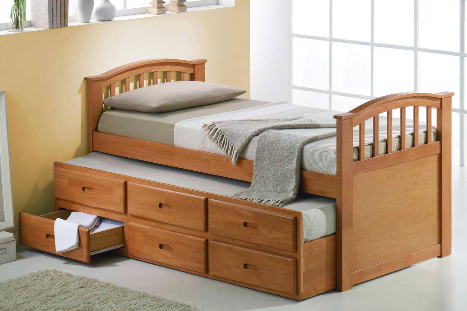 wooden guest beds with mattresses