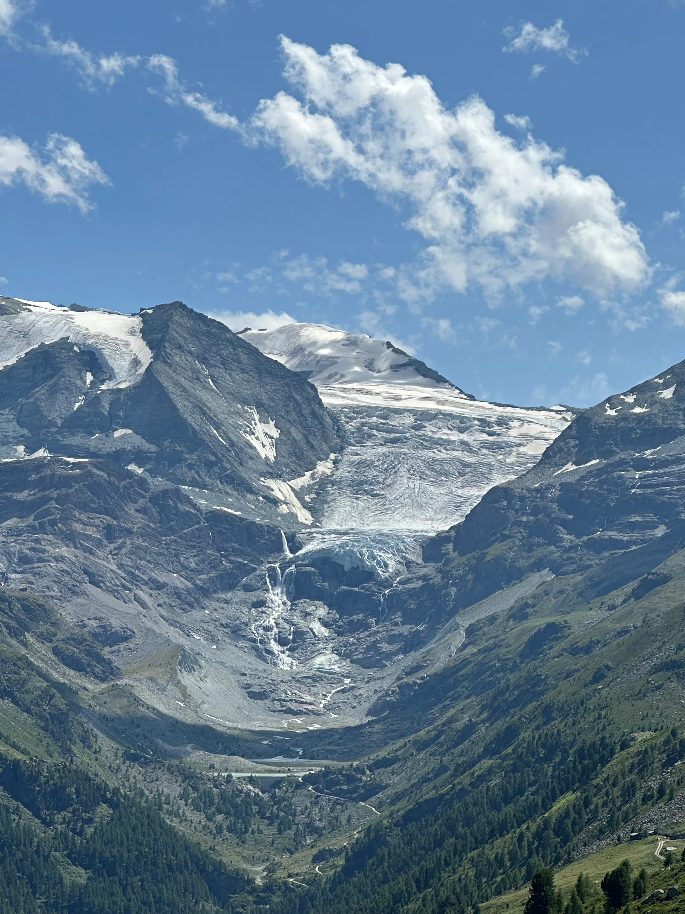 The Turtmann glacier spilling off the face, feeding the waterfalls above Gruben.