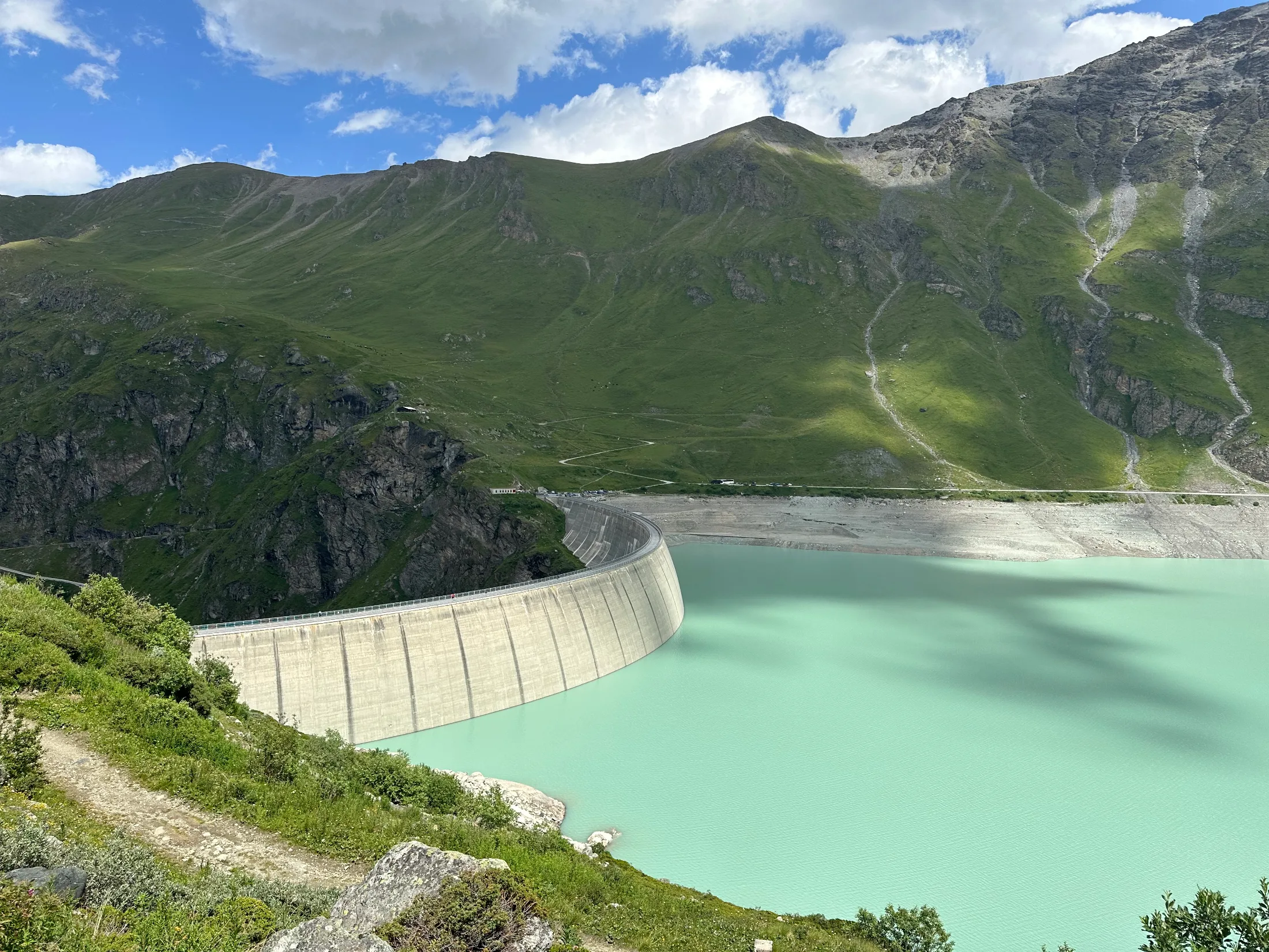 Lac de Moiry held back by its dam, reached on the long descent from Col de Torrent.