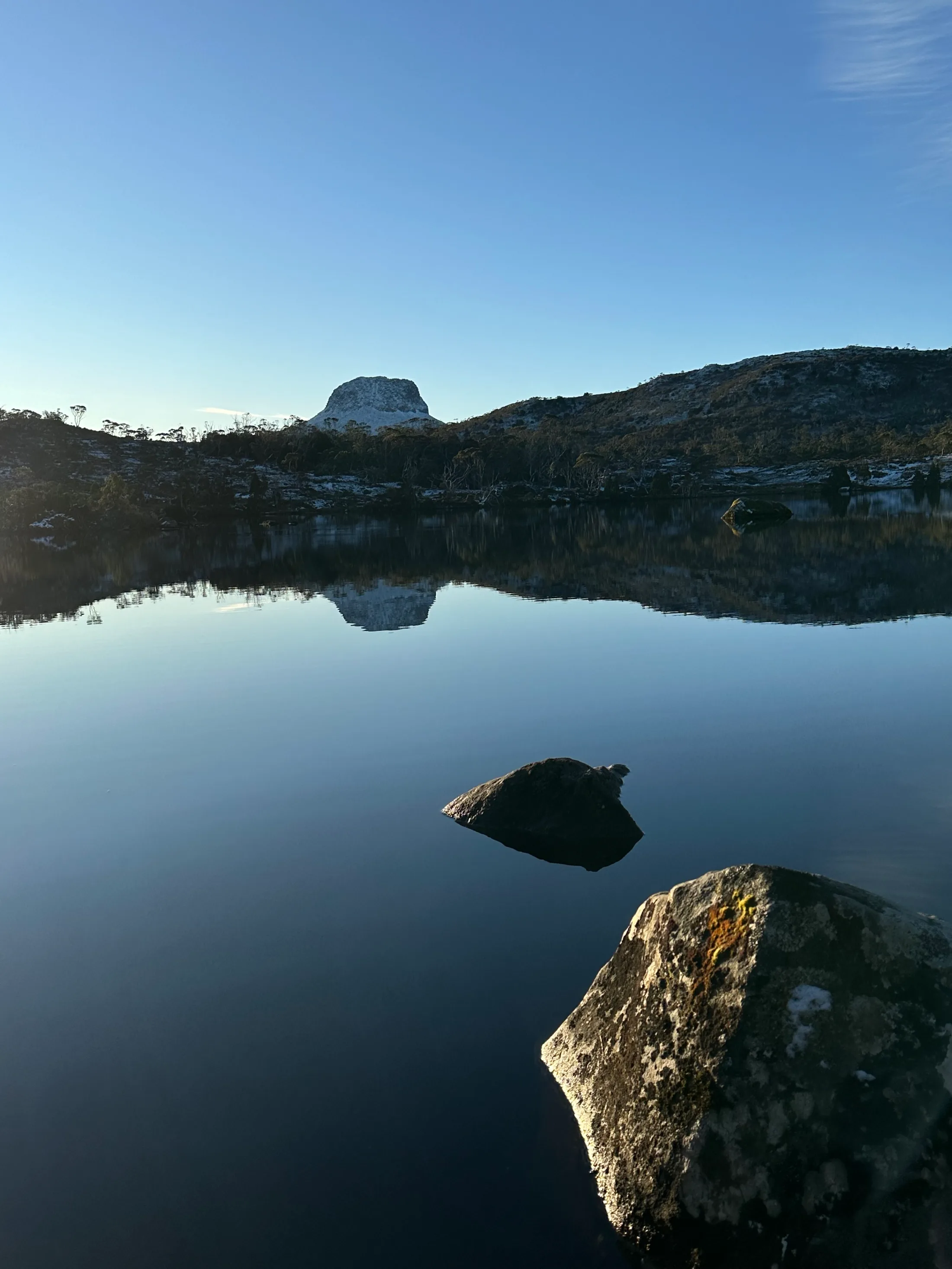 Lake Windermere reflecting Barn Bluff on a still winter morning.