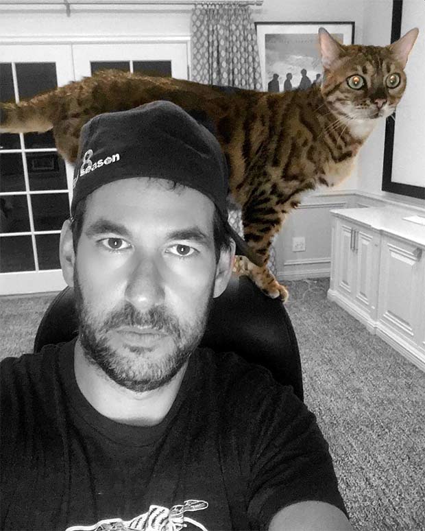 Doug Ellin with his Bengal cat on his shoulders
