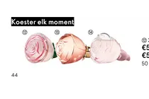 parfumflesjes in de vorm van een roos