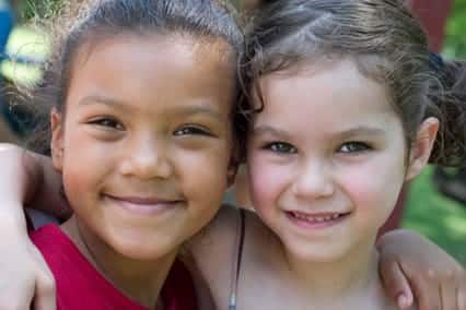 Two girls smiling