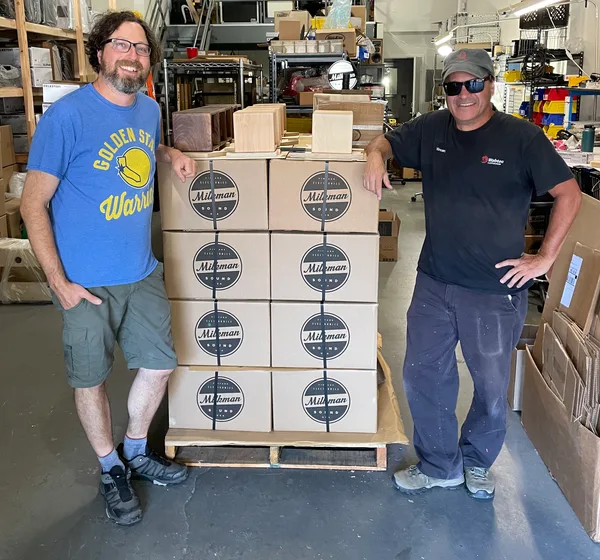 Tim Marcus and a colleague with a pallet of Milkman Sound boxes