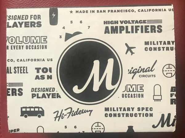 Milkman Sound branded wrapping paper featuring the company logo and slogans