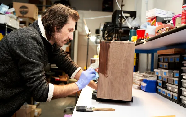 Chris finishing a walnut cabinet in the Milkman Sound shop