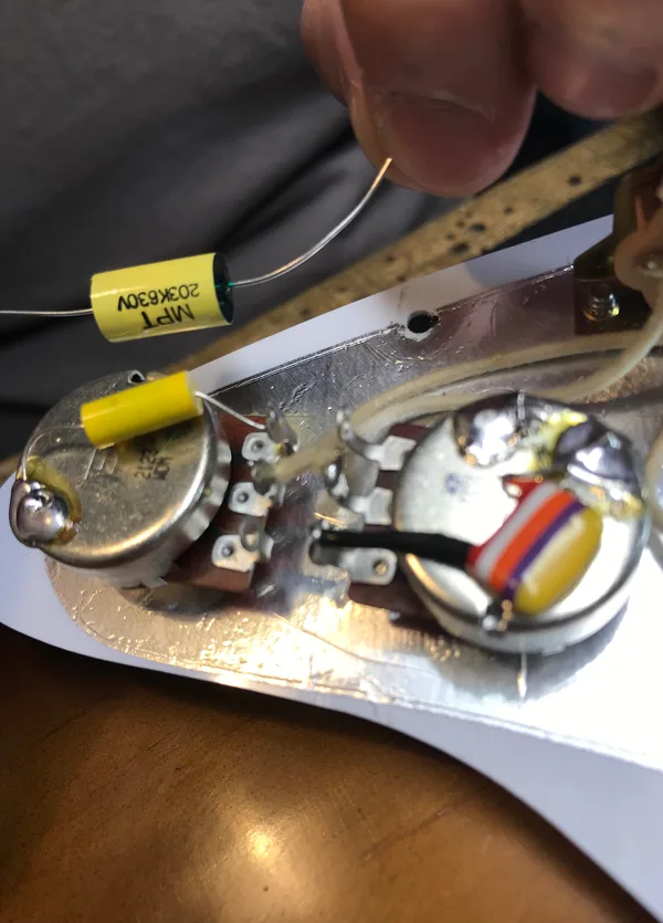 Close-up of Izabella loaded pickguard wiring, Bourns pots and capacitors