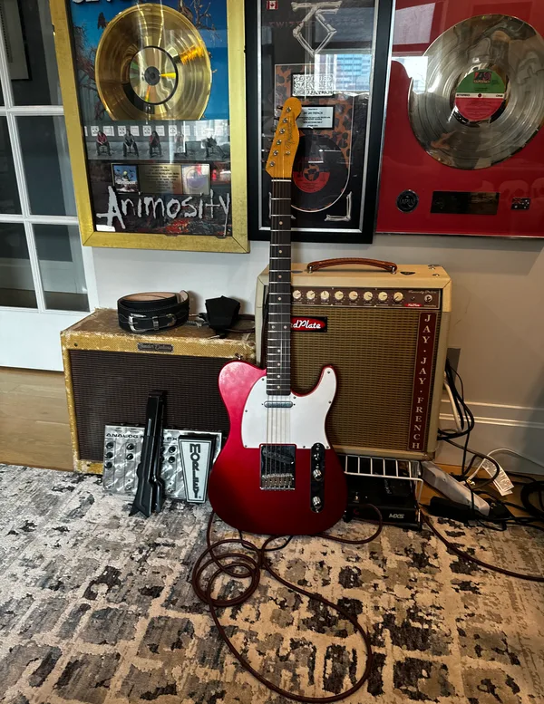 Jay Jay French's parts-built Telecaster with amplifier and gold records in background