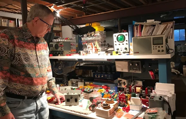 Carl Hartman at his electronics workbench