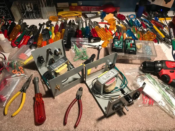 Carl Hartman's workbench with tools and Amp Maniac components