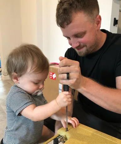 Justin working with his young son