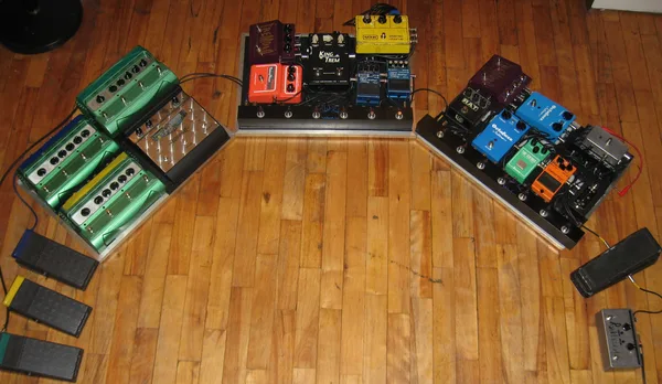 Old pedalboard with three Line 6 DL4s.