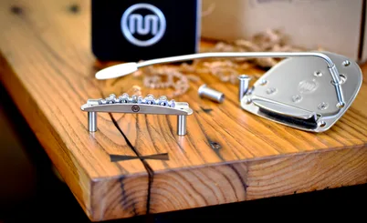 Mastery Bridge M1 and OMV vibrato on a wooden surface