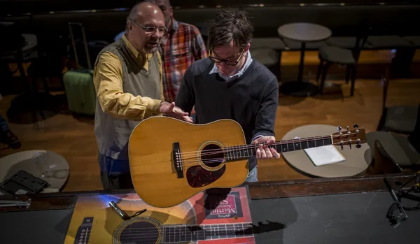 Woodland inspects John Lennon's 1962 Martin D-28