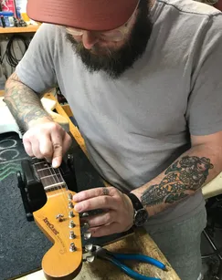 Clancey doing final setup on the TQ Jazzmaster