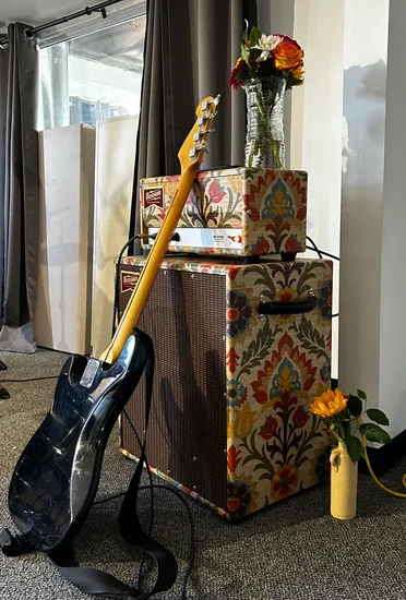 Benson amp with fabric cover and guitar
