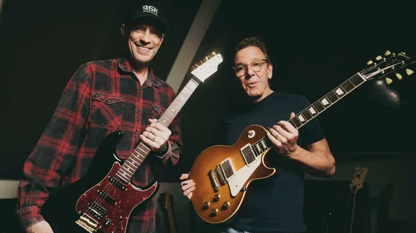 Gordon and Dann holding guitars