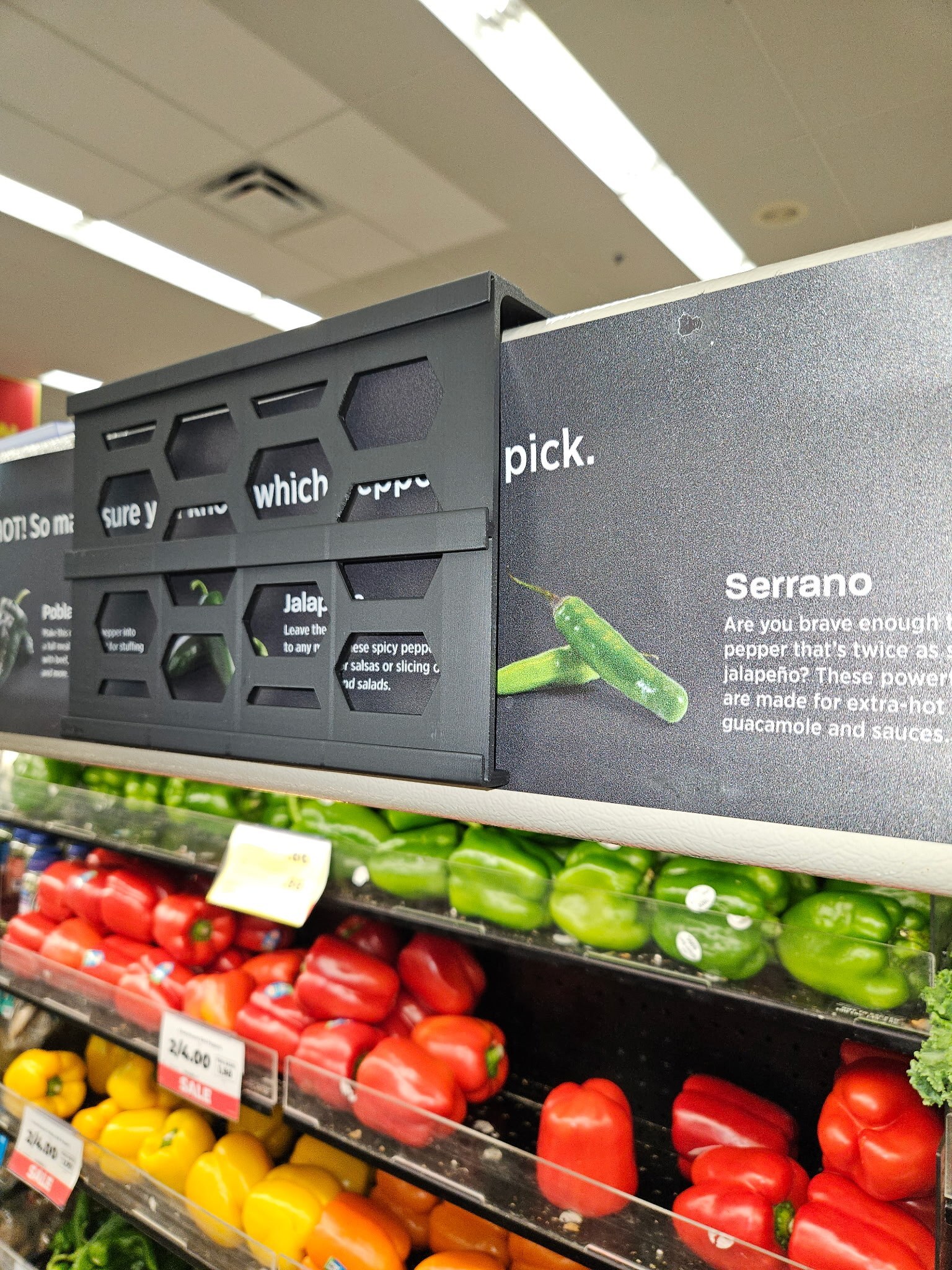 Multi Label Canopy Bracket installed on a produce case