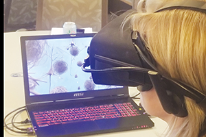 Photo of Sue Wilber, director of housing at Saint Anne of Winona, Minn., taking part in the Beatriz virtual reality training module created by Embodied Labs