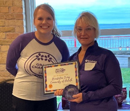 Stacie Oakland and Brian Pattock with award