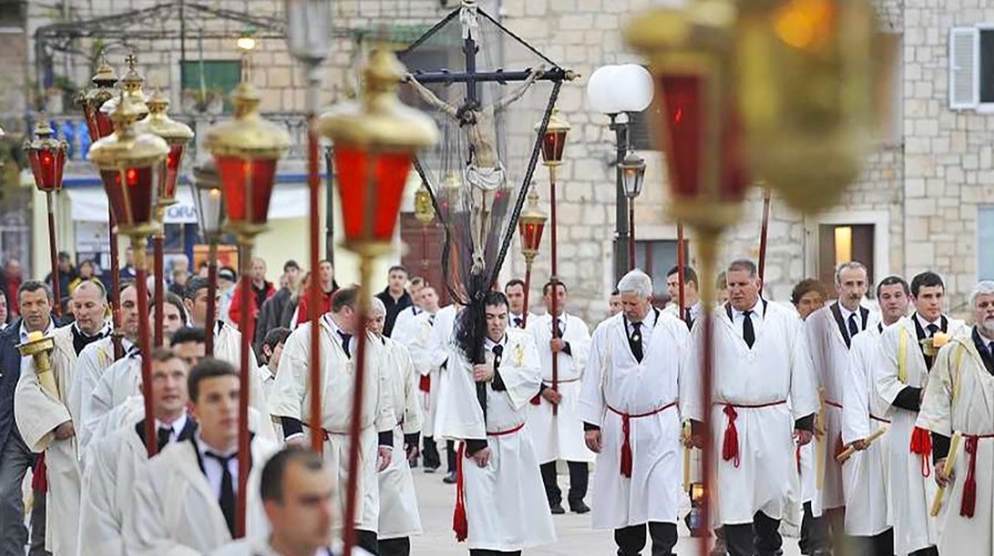 FOLLOWING THE CROSS PROCESSION