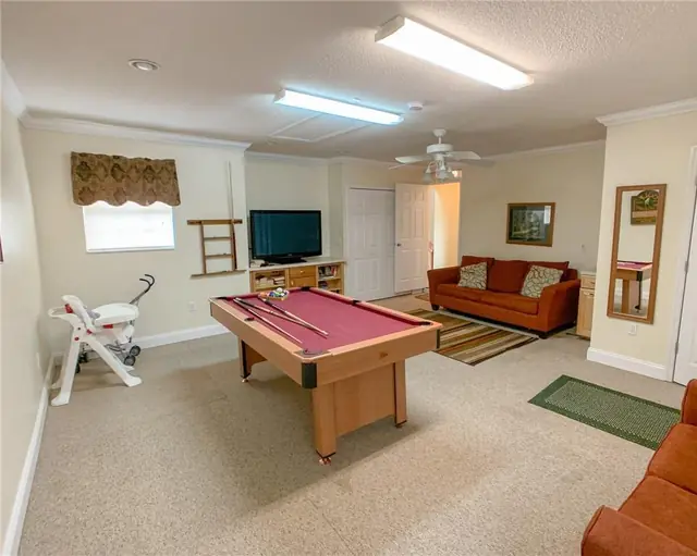 Ellis Rentals: Game room with pool table