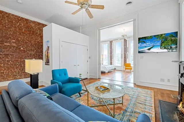 NULU Oasis: Living area with blue sofa