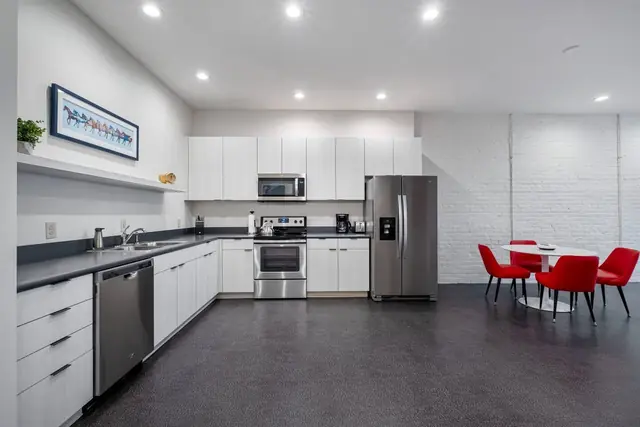 The Grand Slam: Kitchen with white cabinets