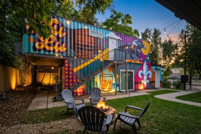 4-Unit Group Stay in NuLu | Shipping Containers 1-4: Colorful mural and fire pit seating in the yard